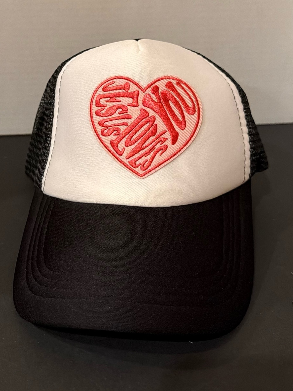Black & White Trucker Hat with Red Heart “Jesus loves you” Patch. Custom